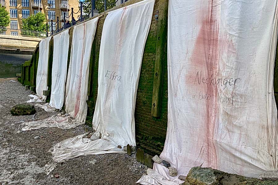 Installation view of Mary Lemley's banners on the Thames foreshore
